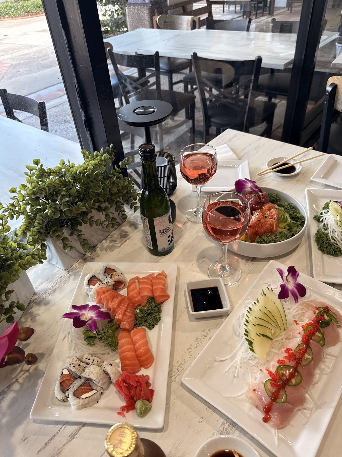 A large catered rainbow roll and sashimi platter by Chef Rudy